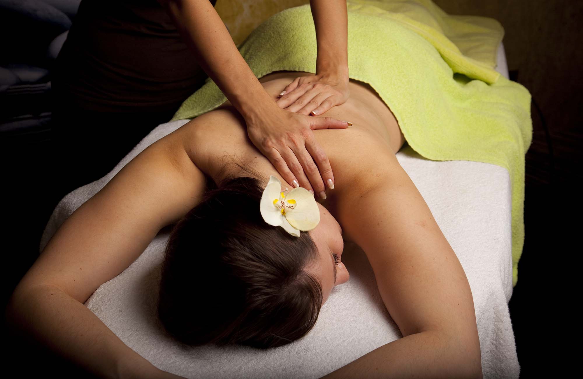 Massage in SPA center METROPOLIS Kamnik Slovenia flower orchid, relaxing sensual ladies hands