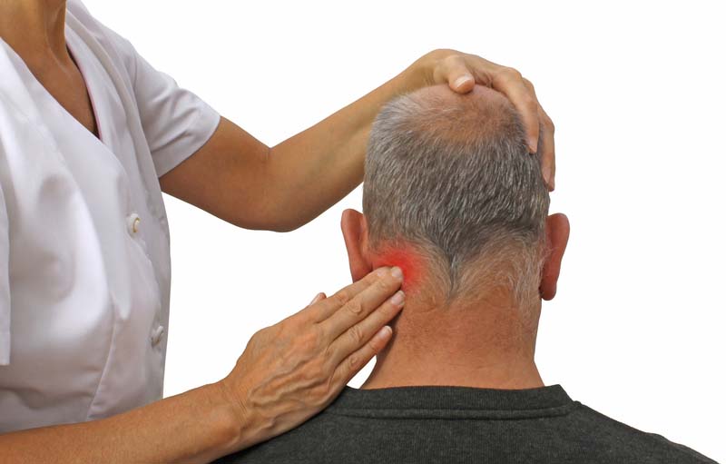 Female sports massage therapist working on male patient s cervical neck muscles with white background